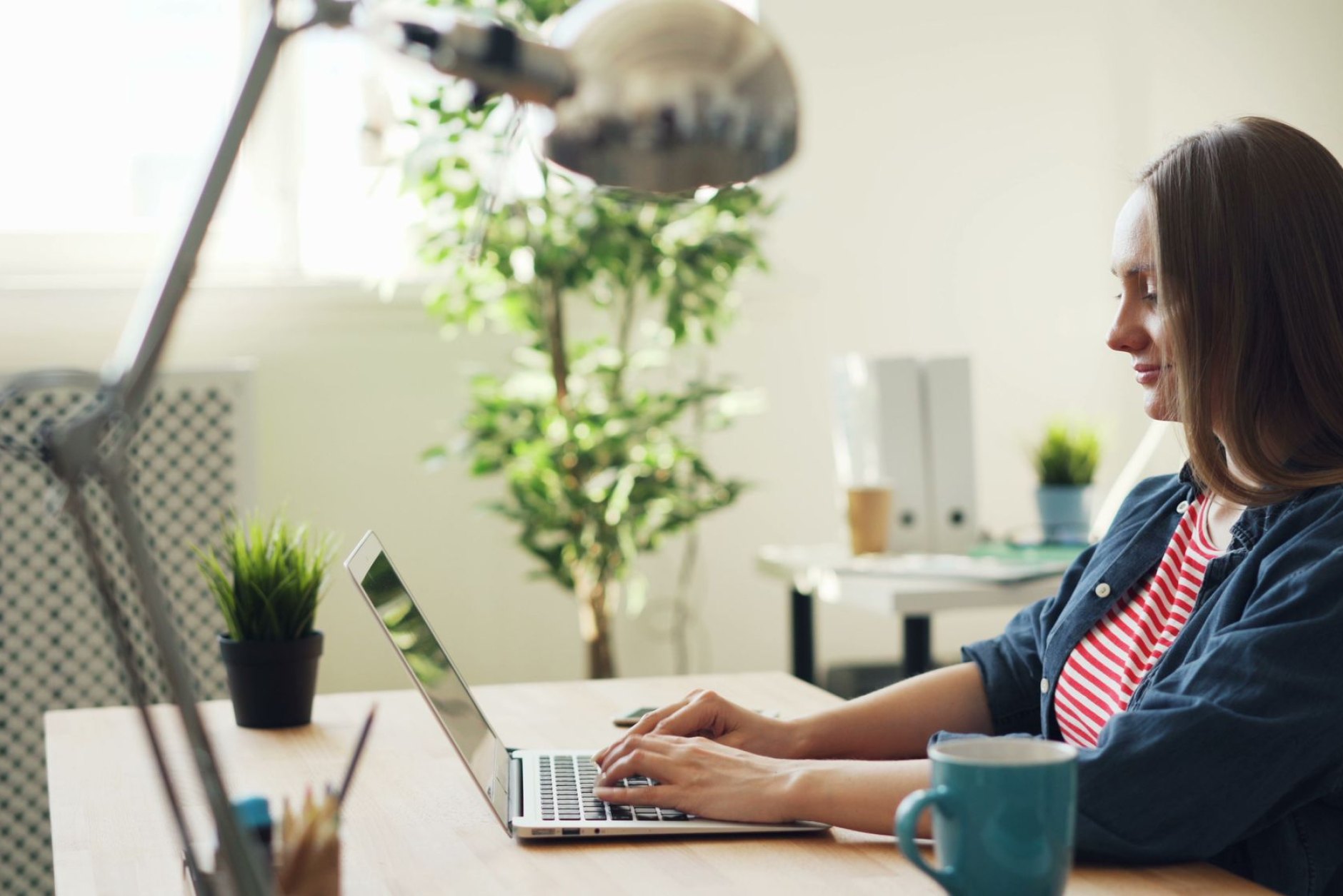 Reviewing financial information on a laptop at home